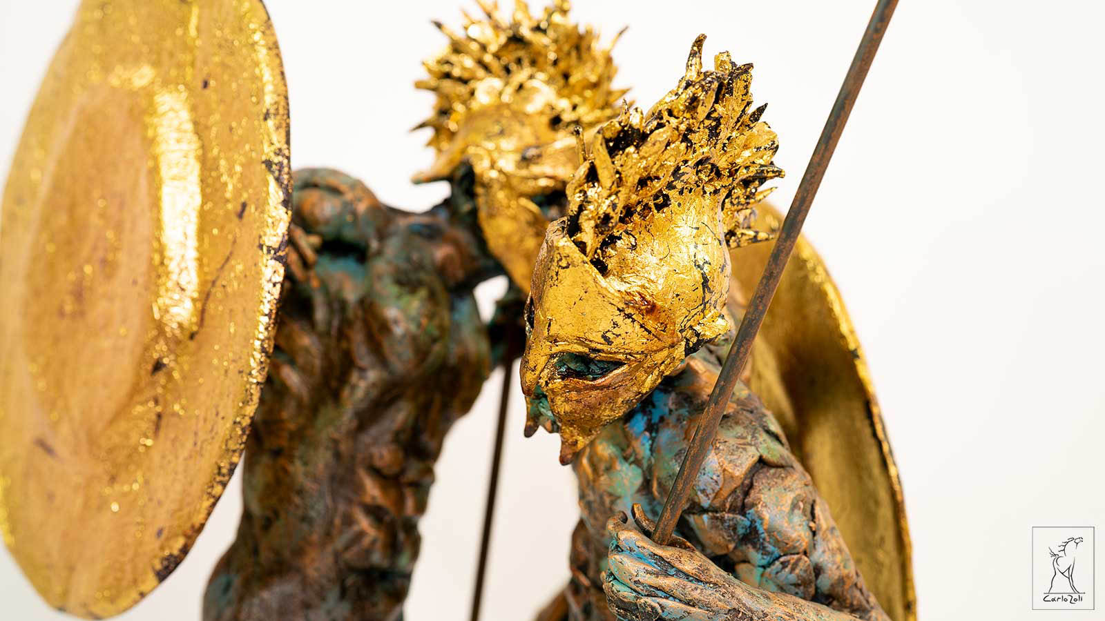 Image: Carlo Zoli: Holy Brothers / Polychrome terracotta, plaster, metal, resins, gold leaf / H.106 x L.47 x P.35 cm / 2022 / Photo: Camilla Valli / Courtesy of INES Forme d'Arte, Faenza (RA), Italy